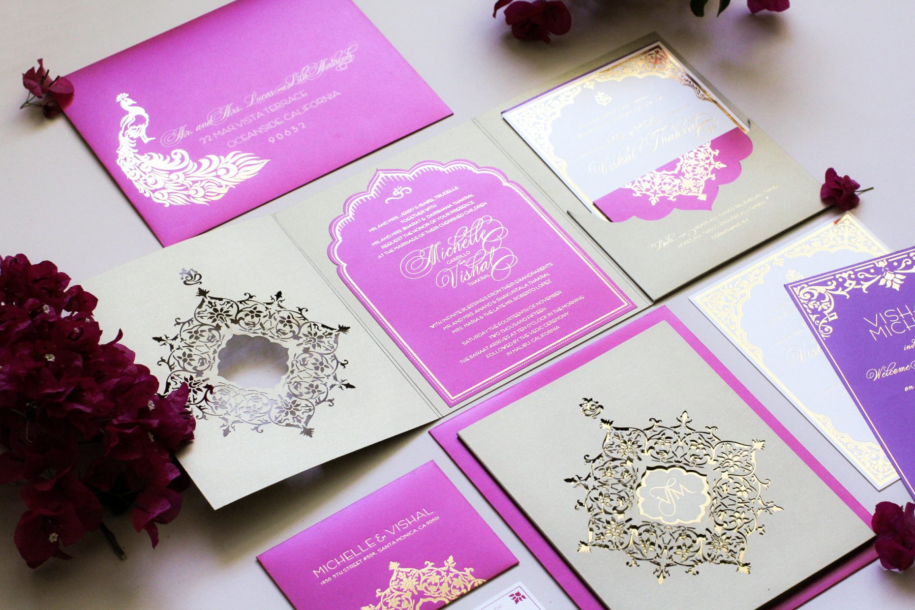 laser cut pink and purple invitation with gold foil printing