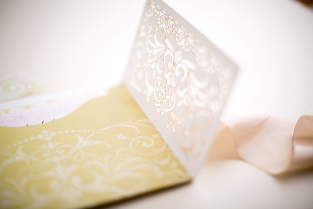 cutwork ivory and cream with gold and peach color wedding invitation