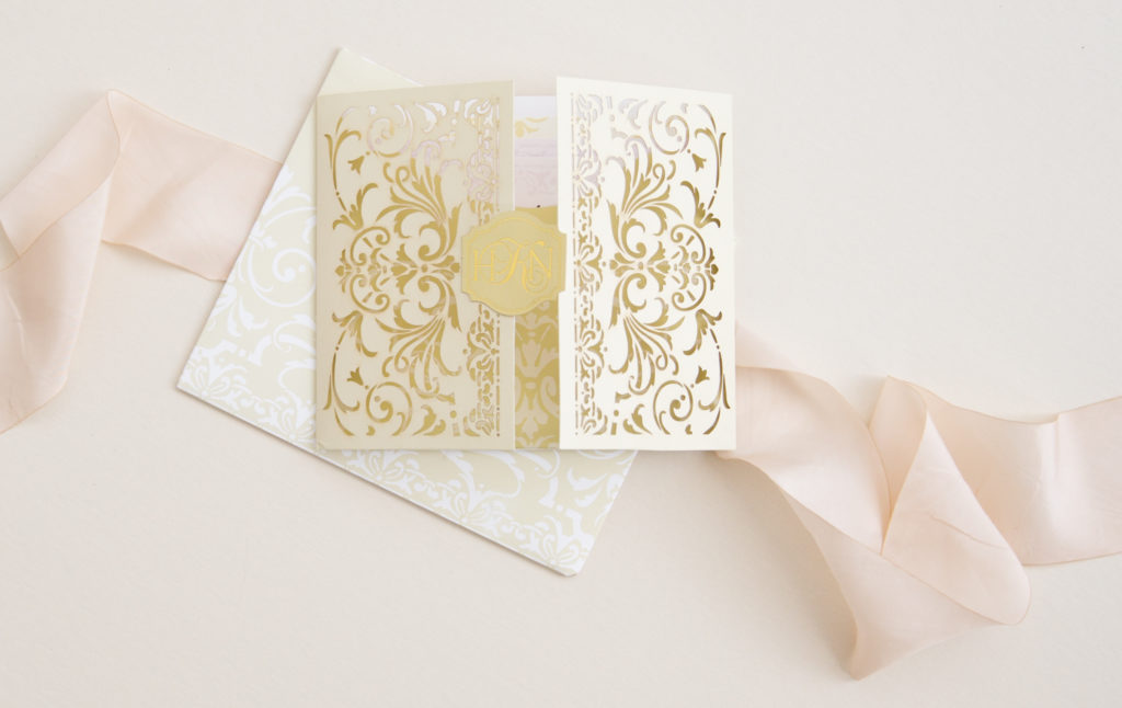 gated wedding invitation with lasercut botanical design