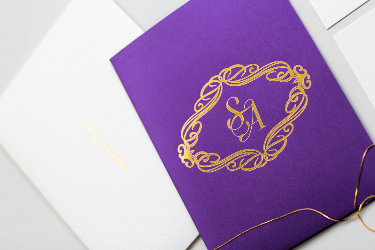 purple and gold invitation suite