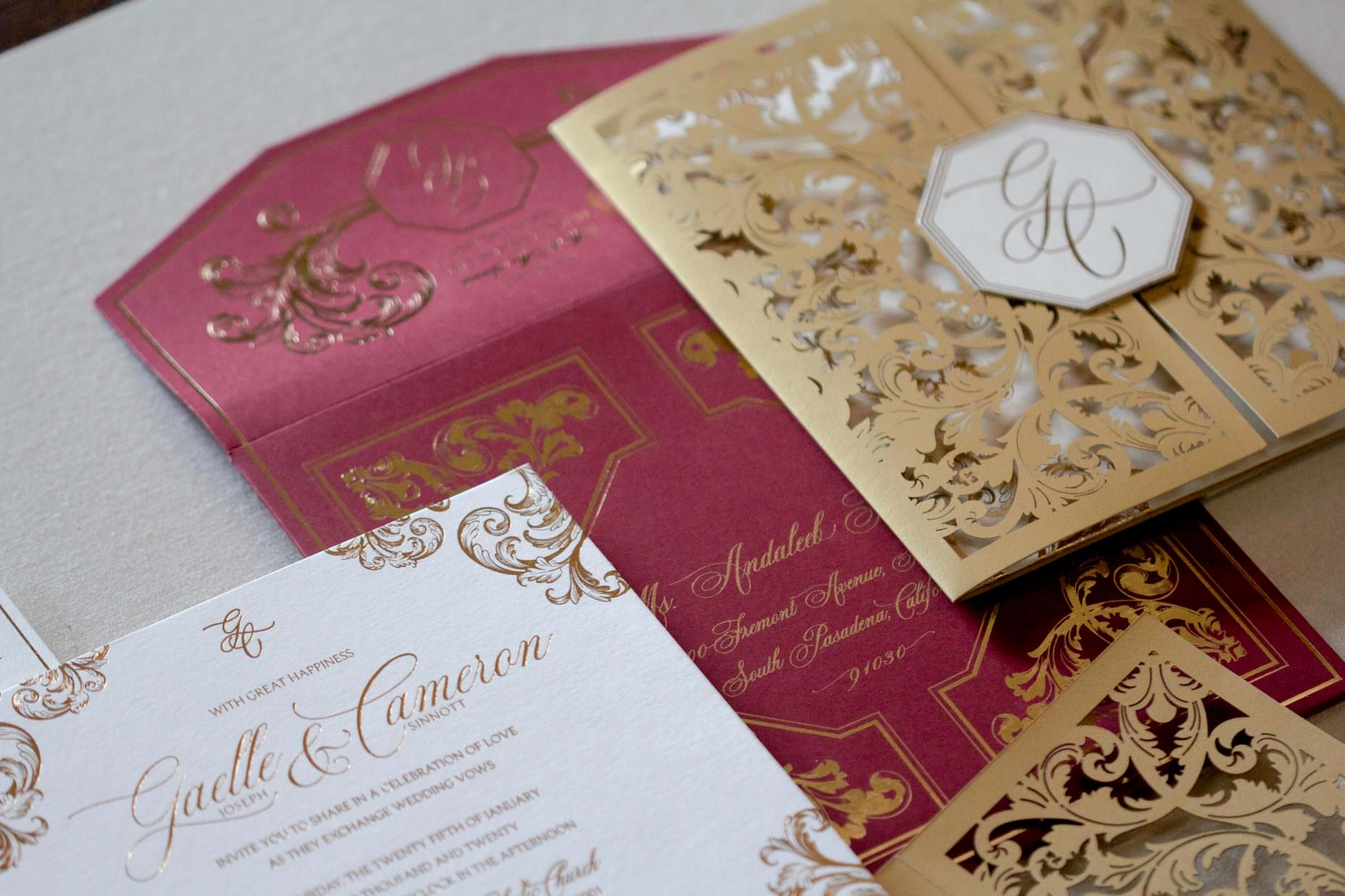 lasercut invitation with gold, ivory and burgundy