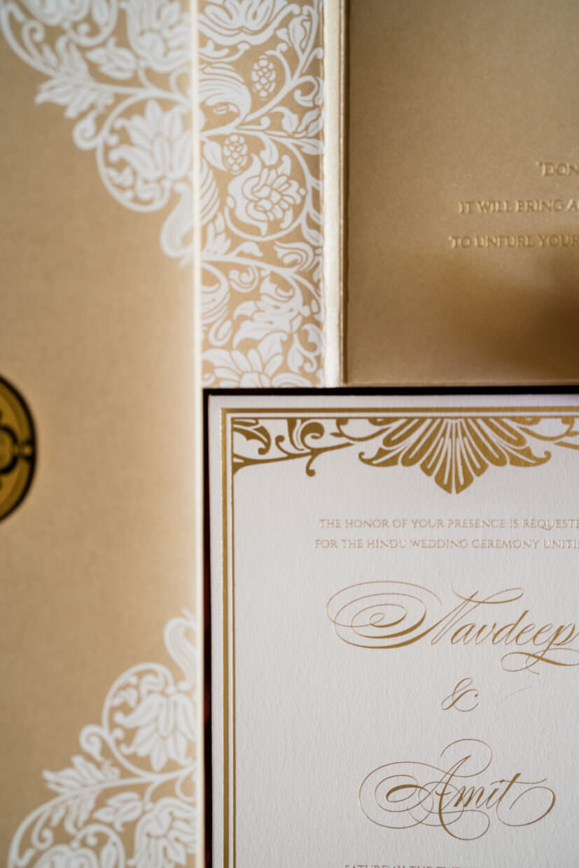 Designer wedding invitation with florals and white letterpress pritning