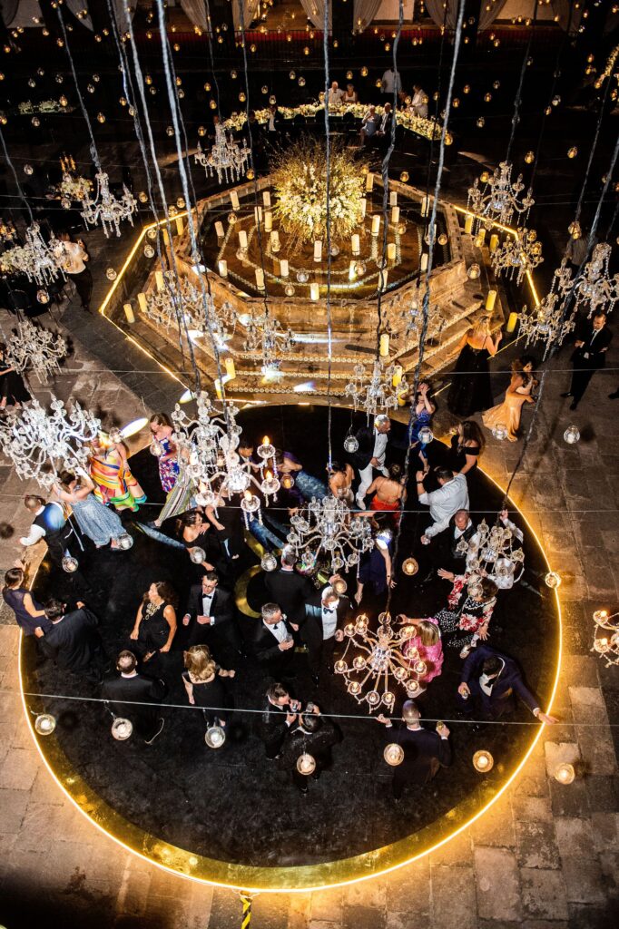 chandelier filled room aerial capture of guests on the dance floor