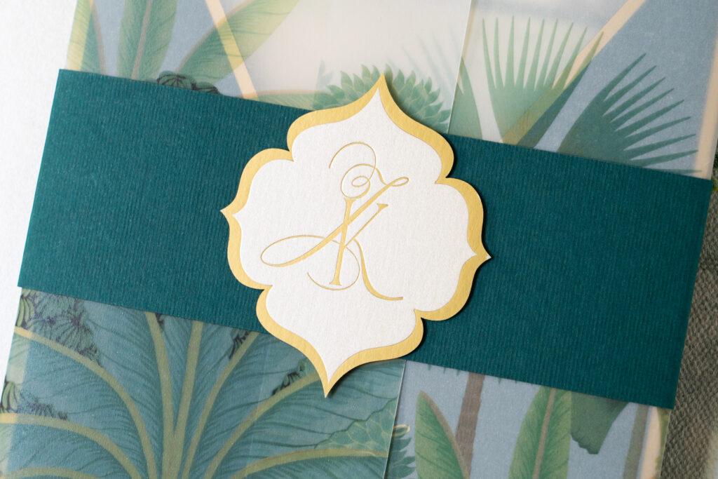 gold embossed monogram with diecut crest by Azure