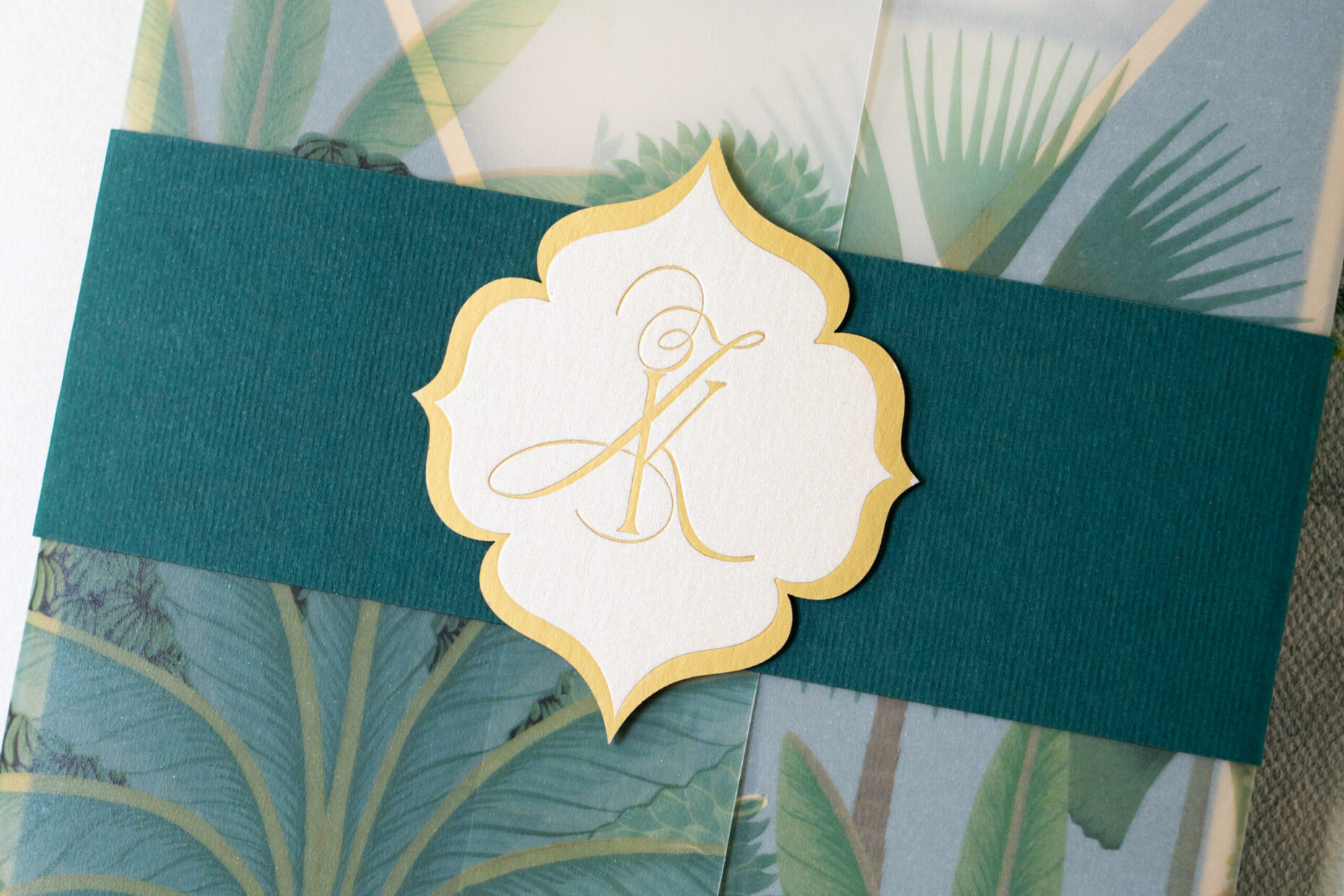 gold embossed monogram with diecut crest by Azure