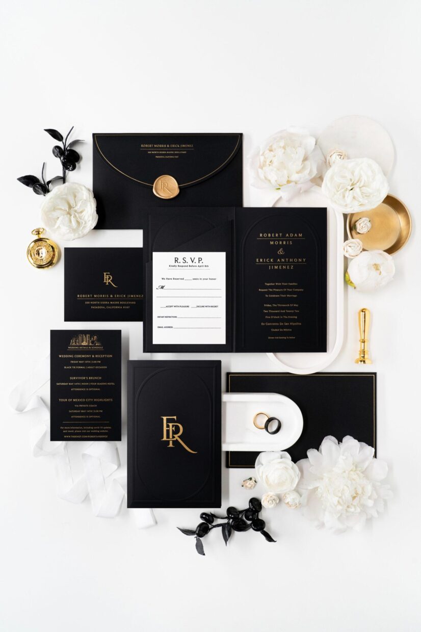 complete custom invitation suite in black and gold with modern embossed design