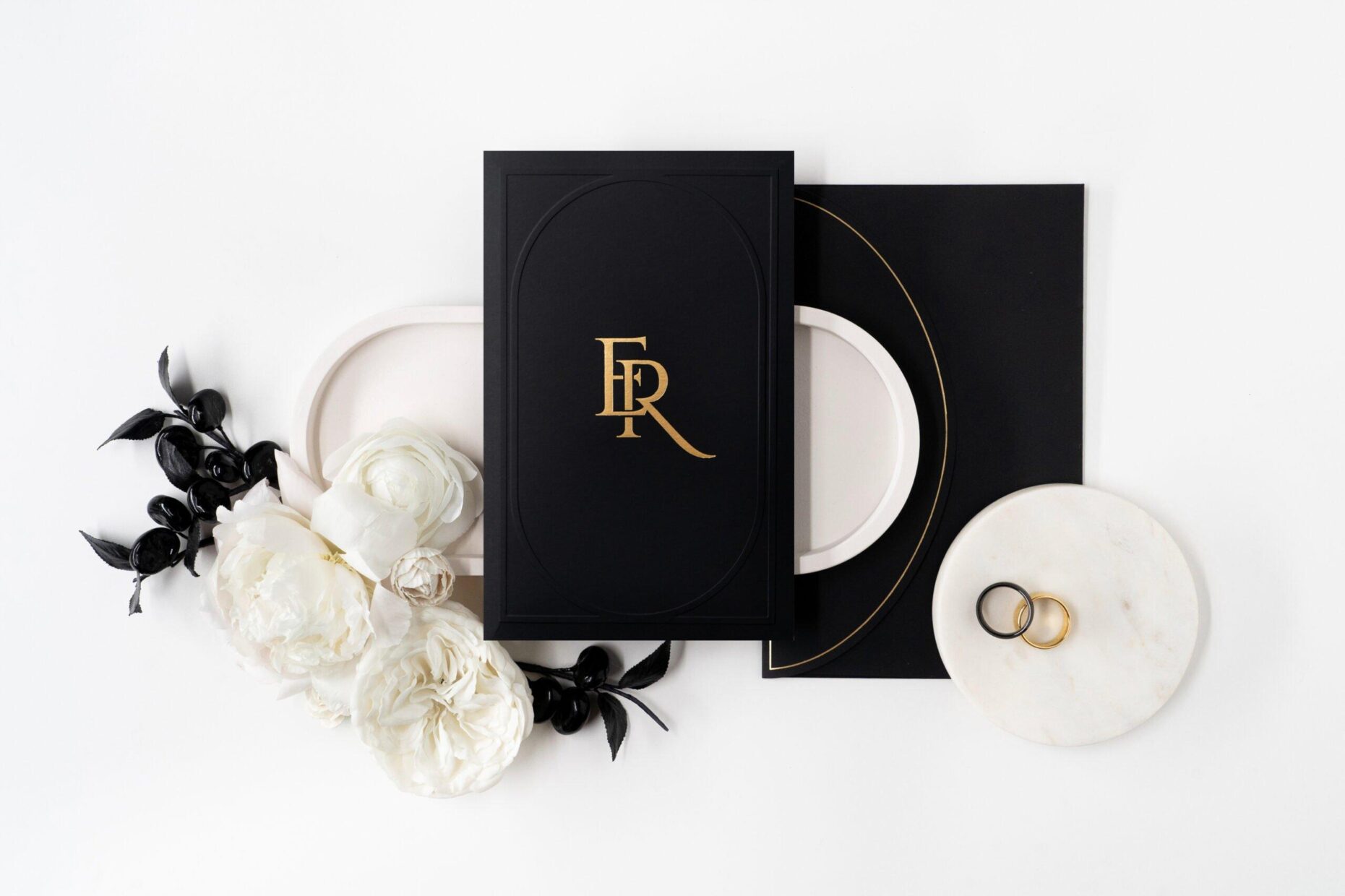 wedding invitation cover with embossing on black and gold